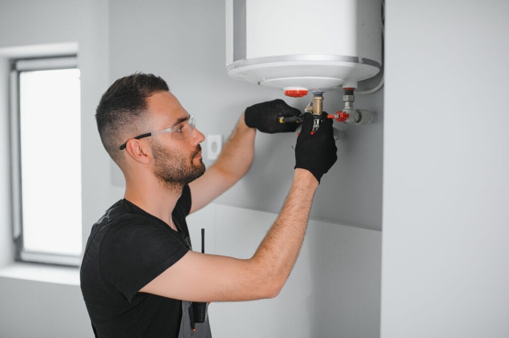 Technician performing water heater maintenance in North Fort Myers